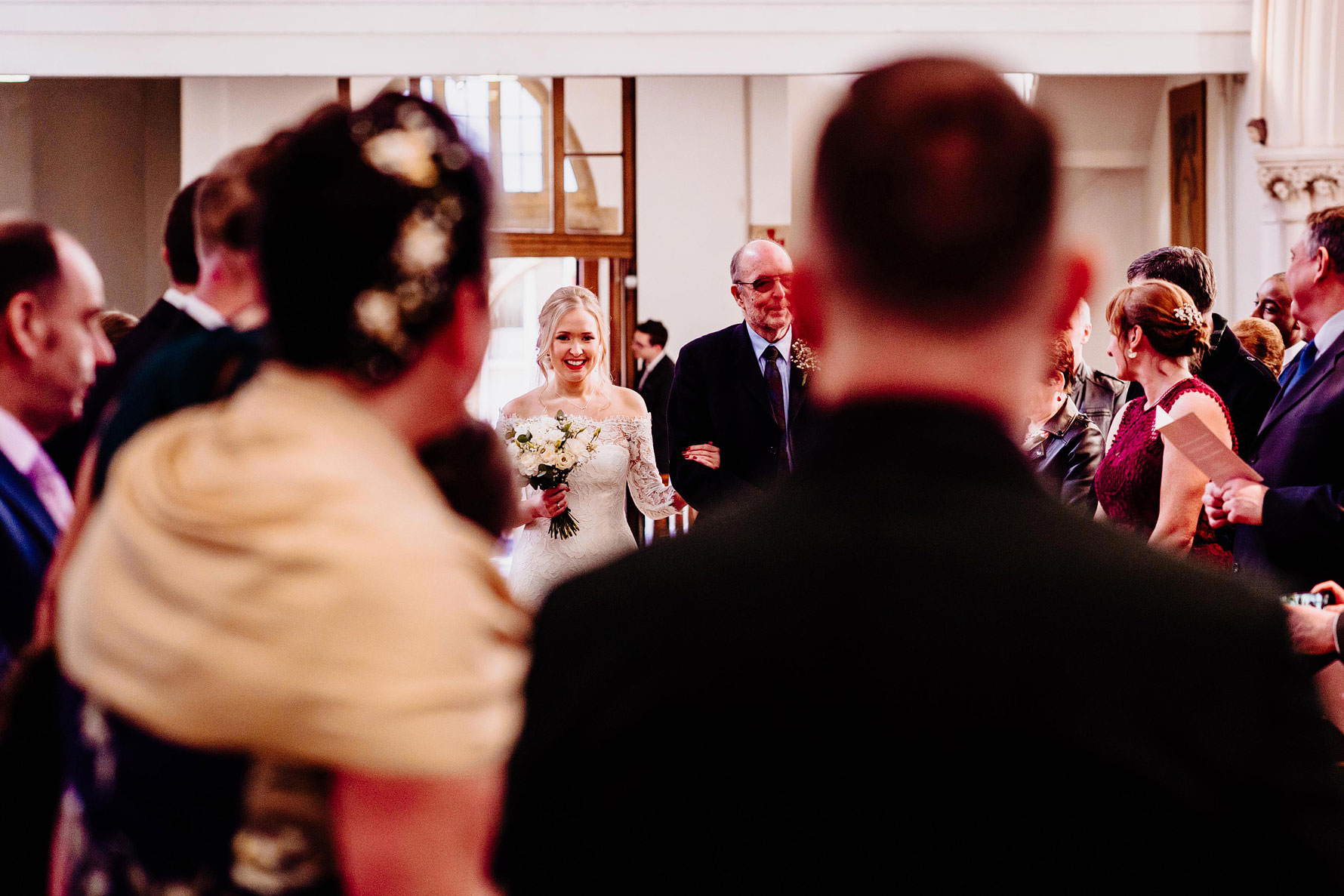 a bride and her father walking down the aisle