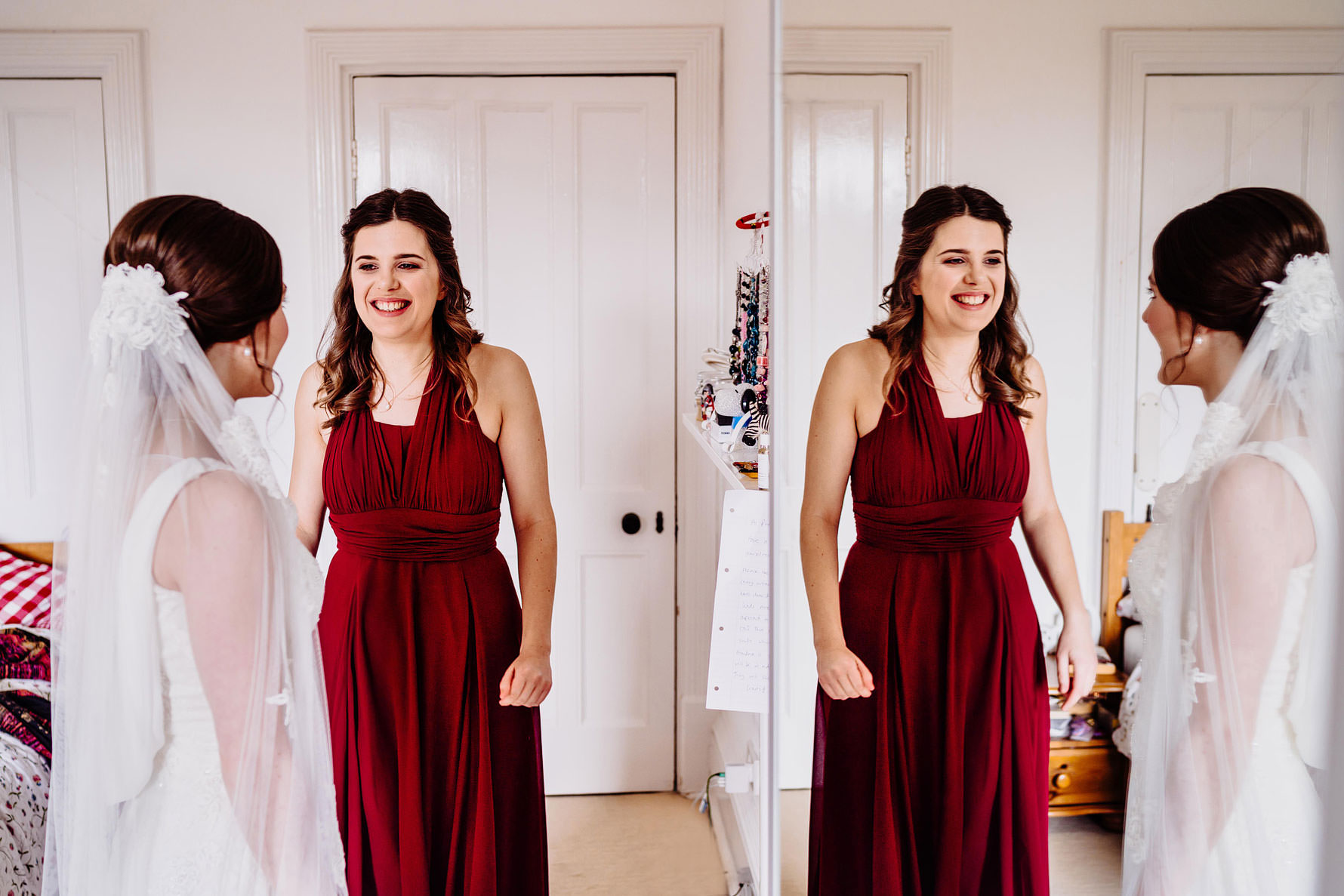 a bridesmaid looks excitedly at a bride